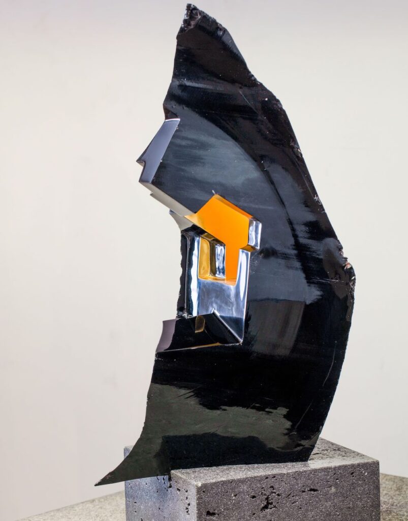 obsidian, gold leaf and volcanic rock sculpture by Jorge Yázpik at the Marion Friedmann Gallery
