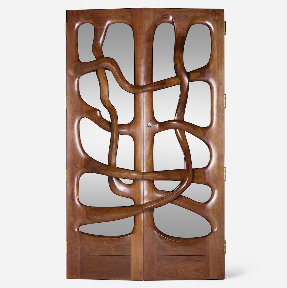 Carved timber doors designed in 1976 by Wendell Castle at the Lillian Nassau gallery as featured in Effect Magazine