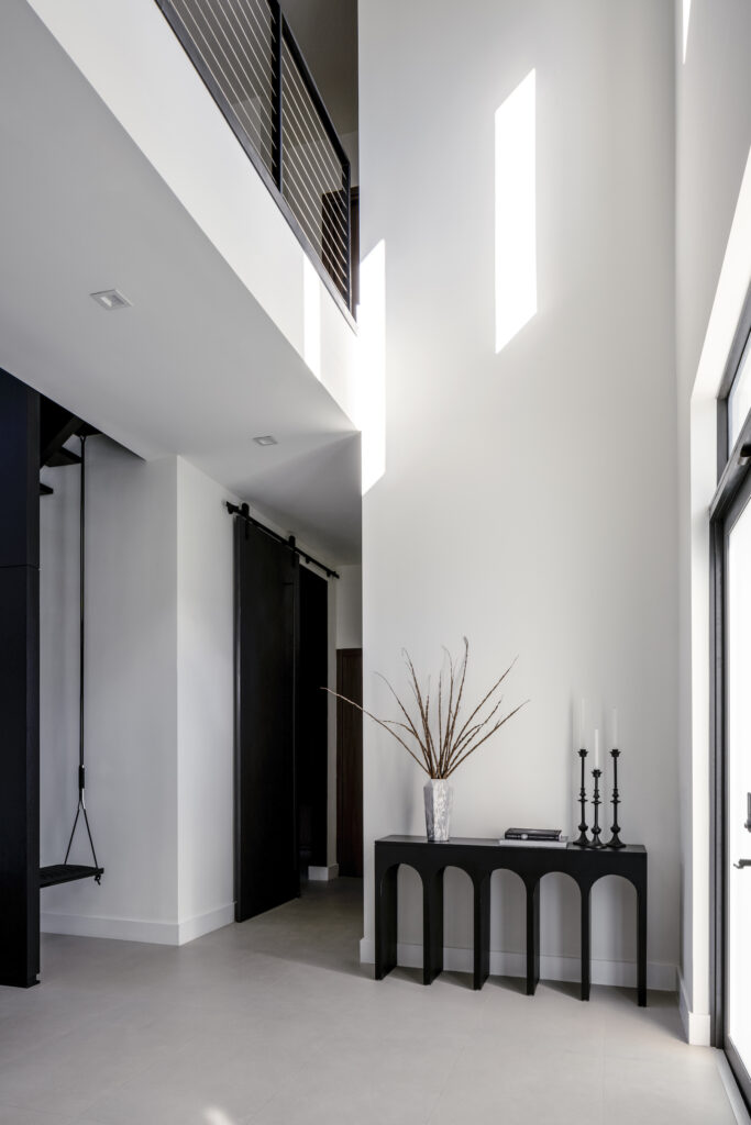 Hallway with interior design by Eilyn Jimenez at the home of Erik Rodriguez “EJ” Manuel Jr in Effect Magazine