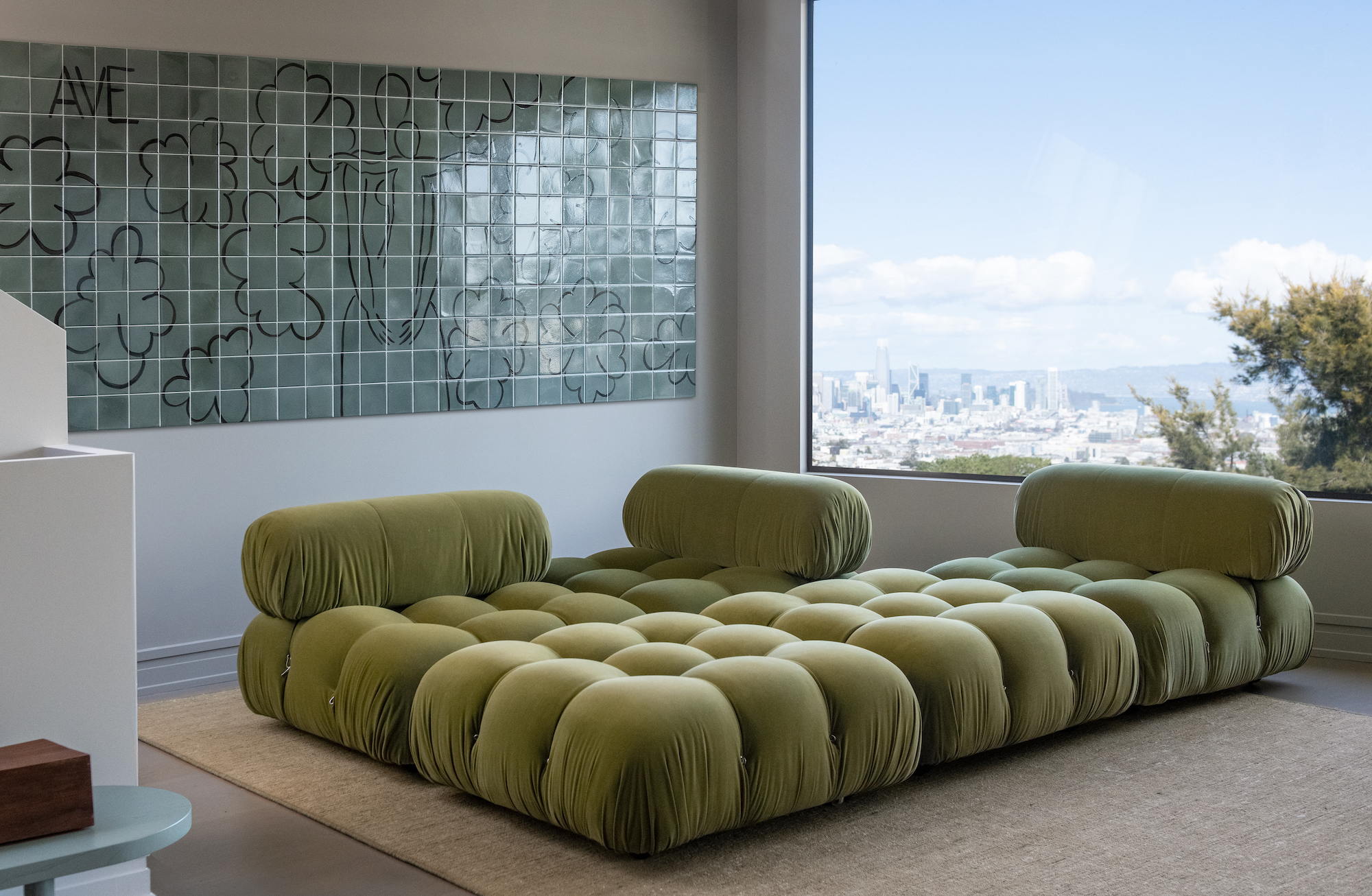 Green sofa in Studio AHEAD's Noe Valley project in Effect Magazine
