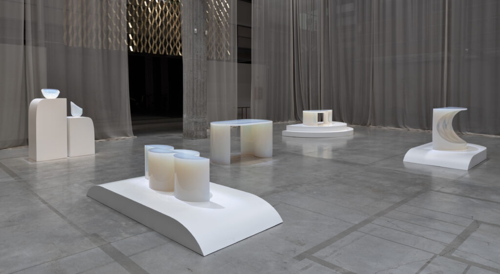 A collection of opalescent resin pieces by Objects of Common Interest at Nilafur Depot at Milan Design Week 2023 in Effect Magazine