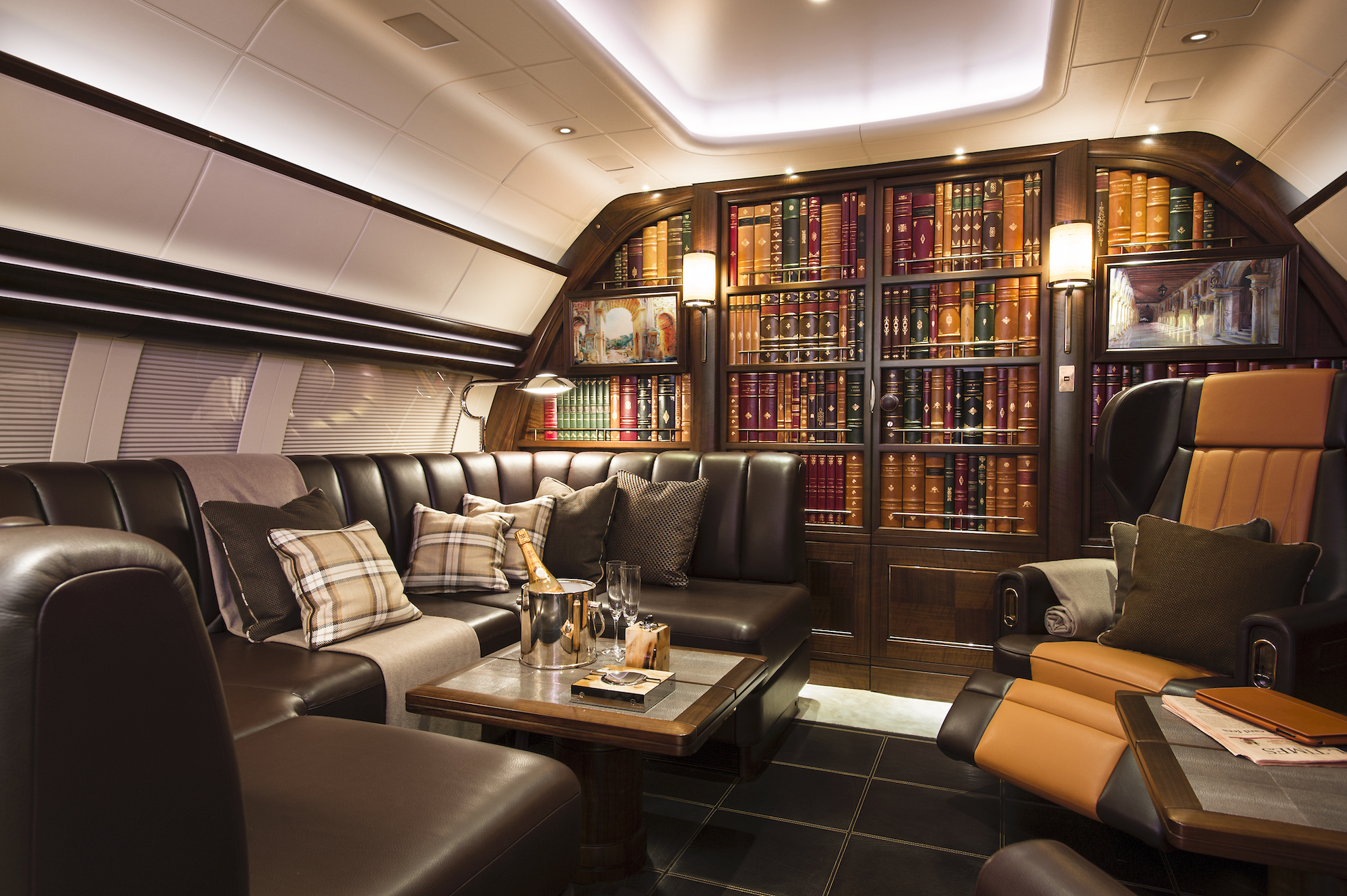 An Atlas jet with interior design by Winch Design. The designers created a book-lined cabin, creating the feel of a private members' club in the sky