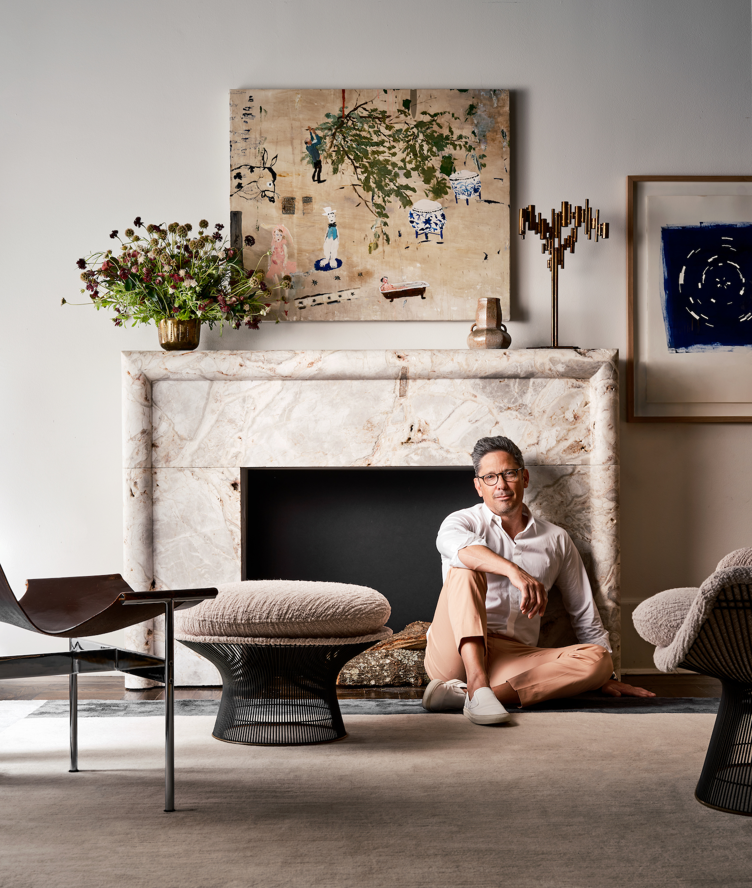 Interior designer Chad Dorsey photographed in front of one of his Strike range of fireplaces in Effect Magazine