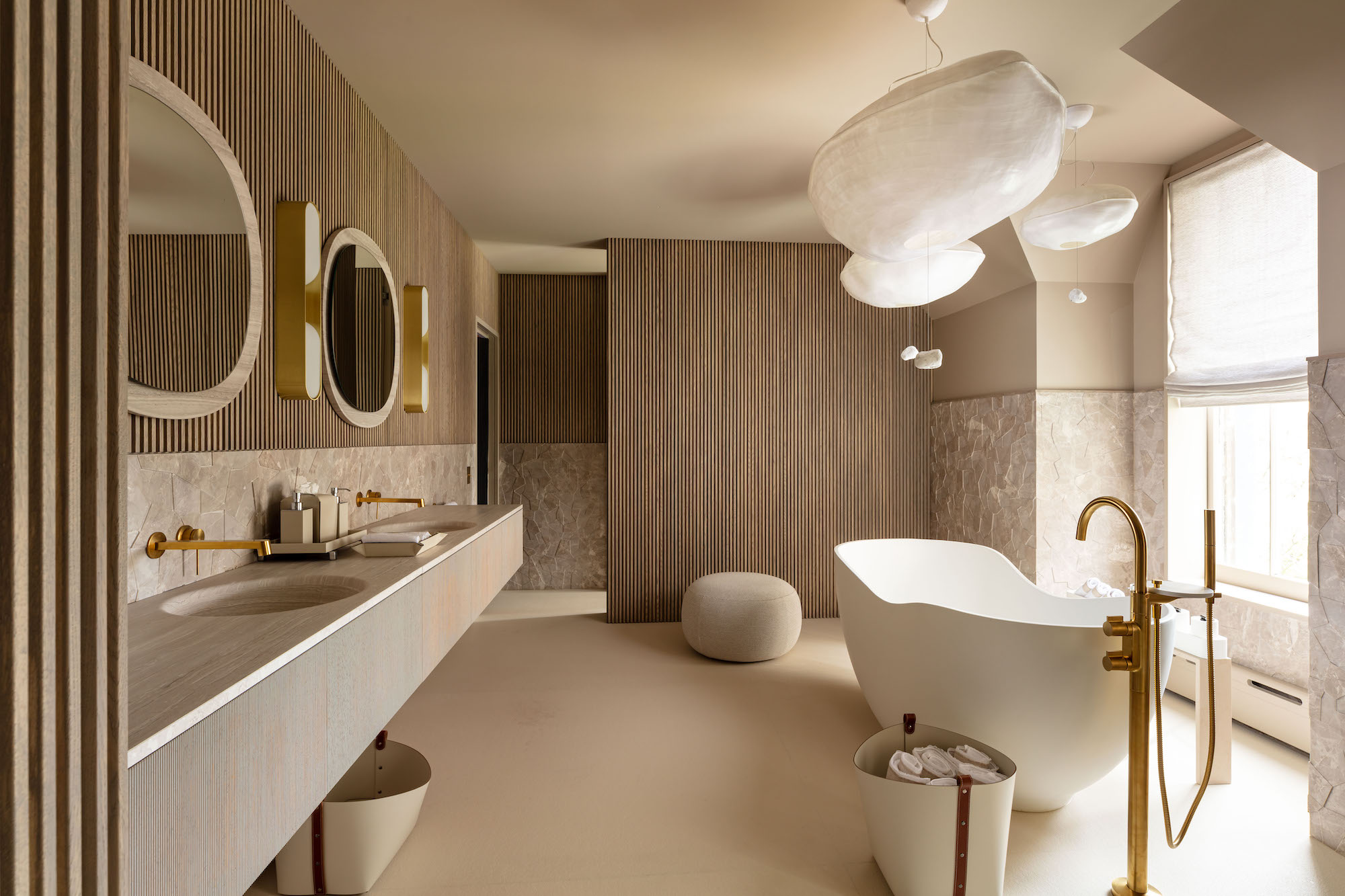 Sergio Mercado created a beautiful ensuite bathroom at Kips Bay Decorator Show House New York 2023 with Japanese washi lights and solid stone - Effect Magazine