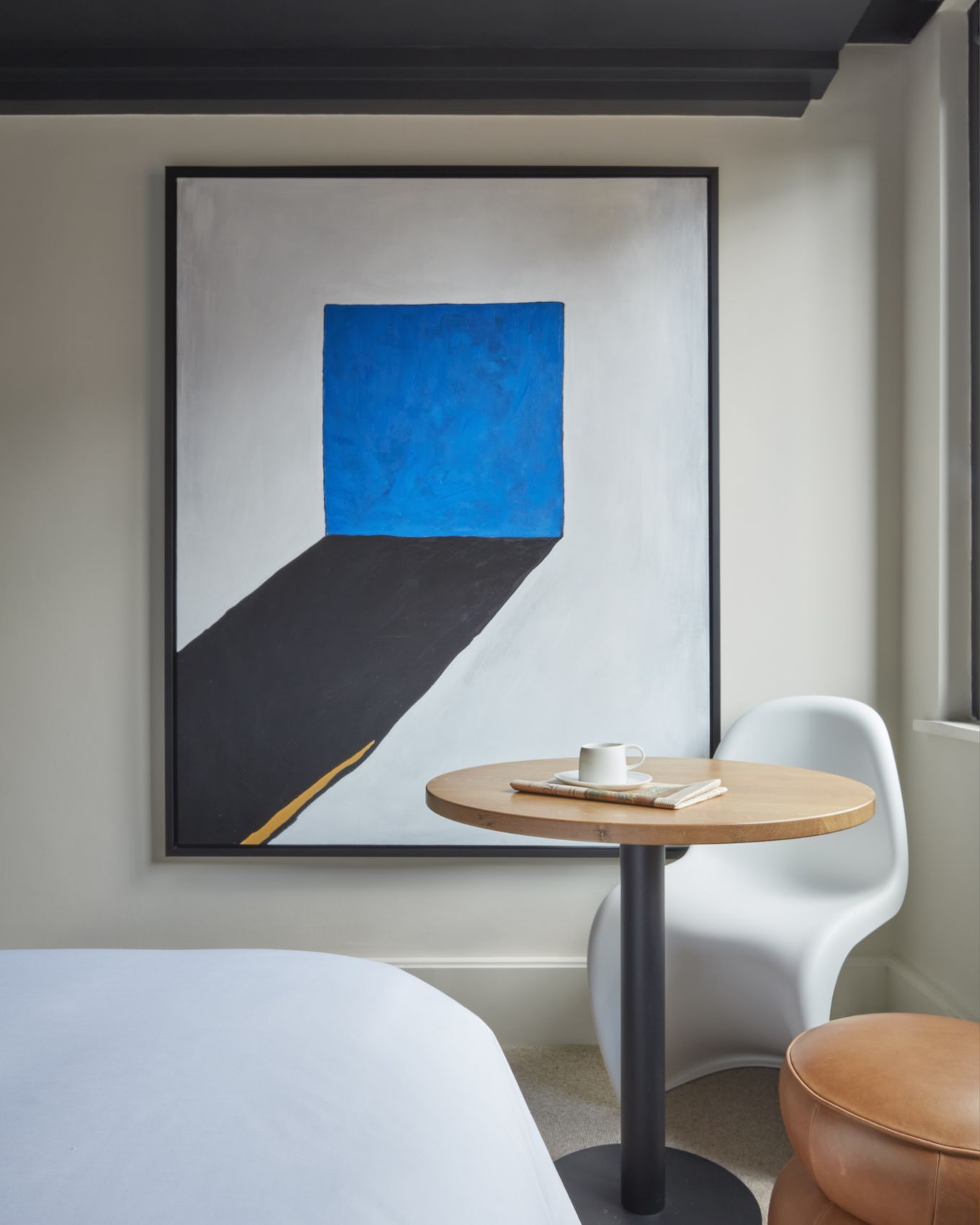 Suite at One Hundred Shoreditch in London, with Verner Panton chair and artwork by Jacu Strauss - Effect Magazine