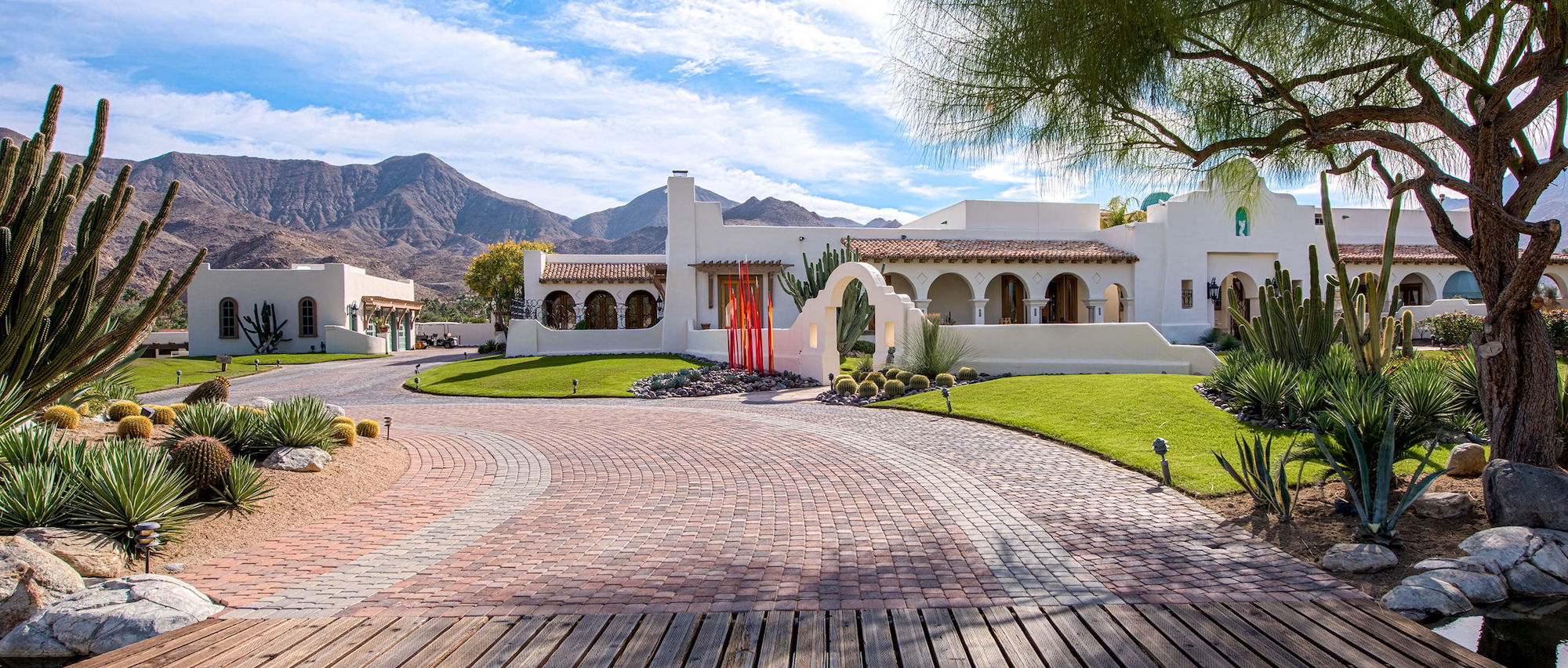 The Pond Estate in Palm Springs is a 12-acre property set against the drama of a desert oasis with a mountainous backdrop