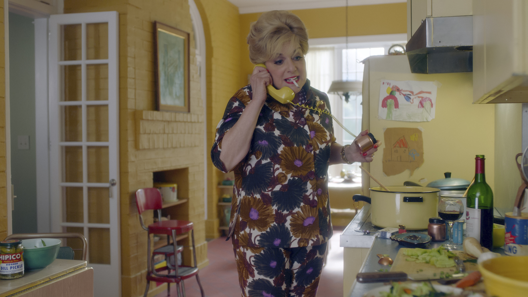 The sunny yellow kitchen of Shirley Maisel (played by Caroline Aaron) in Forest Hills, Queens, one of the vibrant sets of The Marvelous Mrs. Maisel