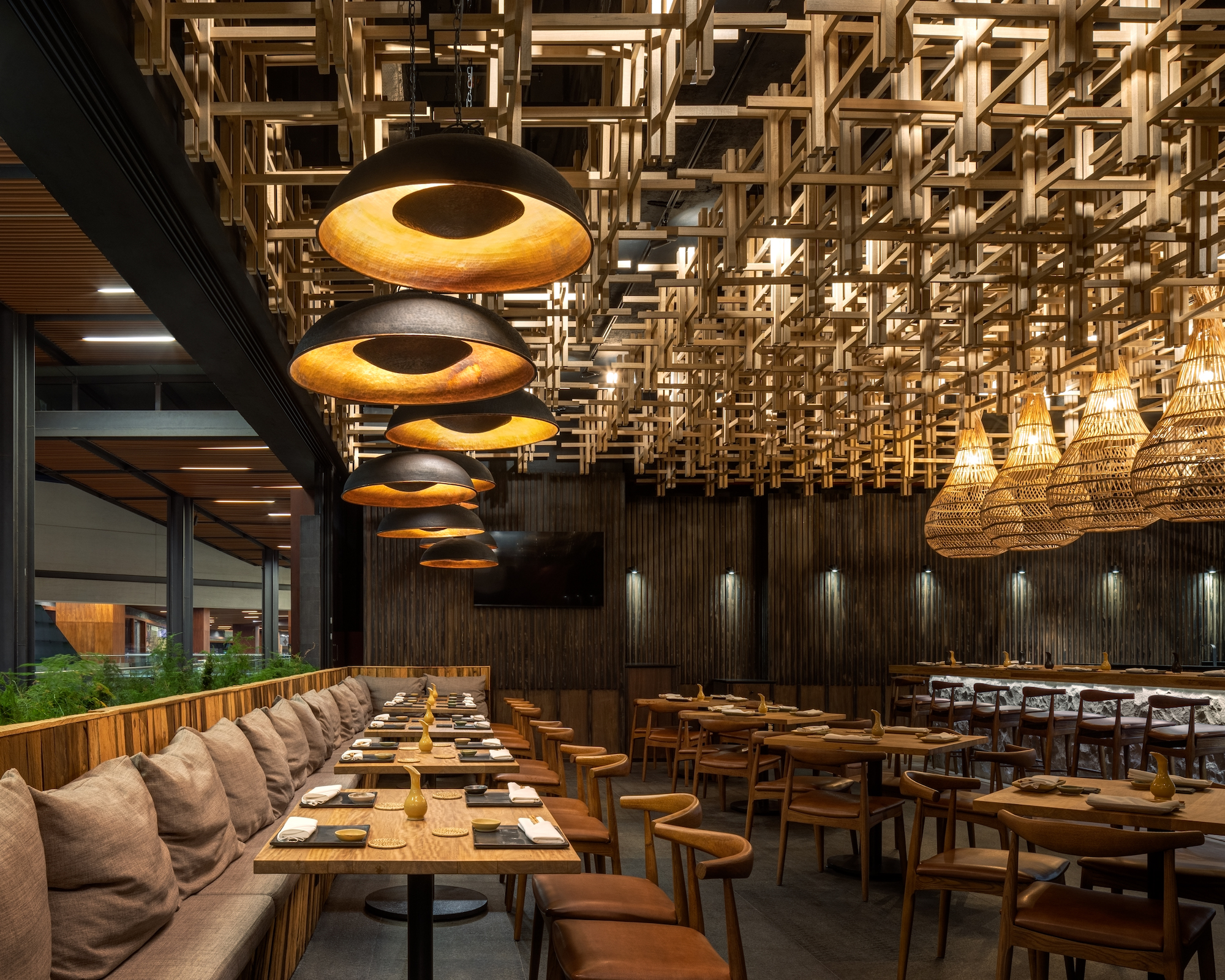 Nama restaurant's interior designer Claudia Ornelas created a dramatic wood structure for the ceiling - Effect Magazine