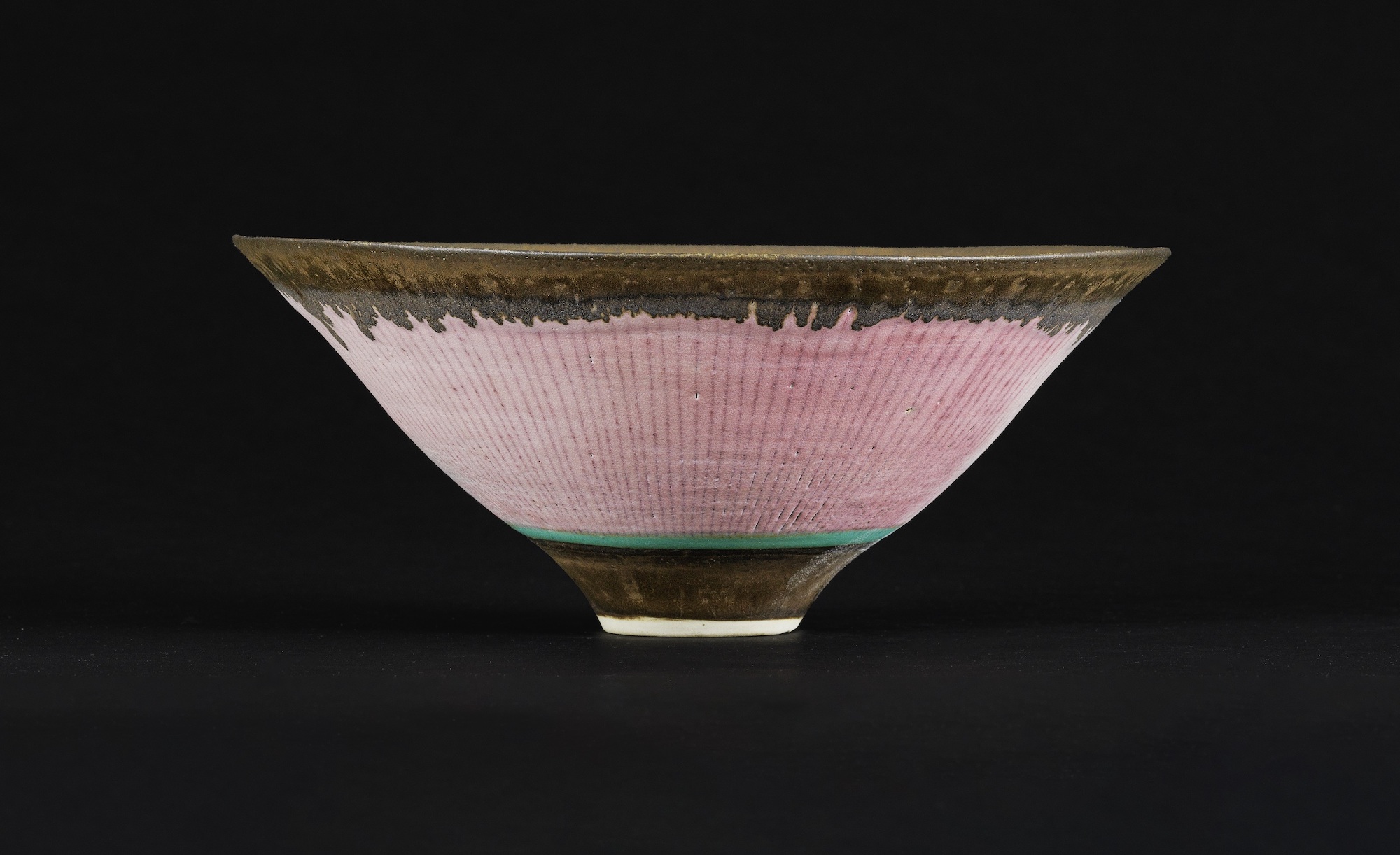 A stunning rose-coloured footed bowl by Lucie Rie, circa 1980